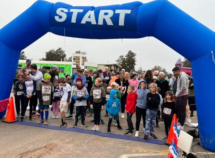 Runners line up at the 2022 Piedmont Turkey Trot starting line on Thanksgiving Day. The trot has been called off for 2023. (Photo by Keri Layton)